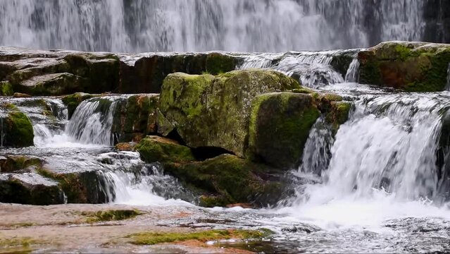 Mountain waterfalls with rocks in the forest, slow motion, close up, hd. ProRes 422 HQ.