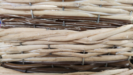 Texture of basket surface. Pattern background. Wooden Vine Wicker straw Basket. handcraft weave texture natural wicker, texture basket, Natural rattan. Detail of a curved basket weave surface