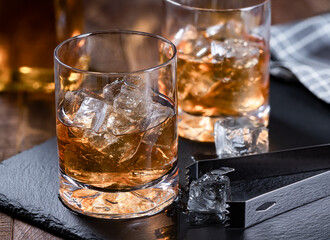 Two glasses of whiskey on ice