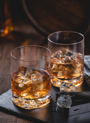 Two glasses of whiskey on ice