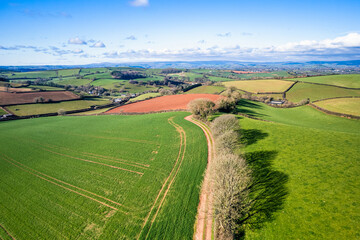 Fototapeta na wymiar Fields and Farmlands in spring from a drone, Devon, England, Europe