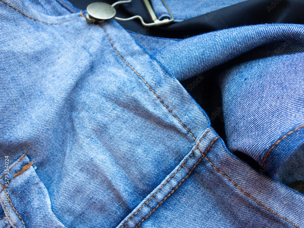 Wall mural detail of clothing with elements of cotton and denim