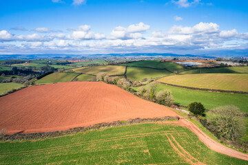 Fototapeta na wymiar Fields and Farmlands in spring from a drone, Devon, England, Europe