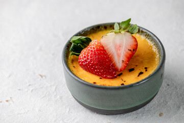 piece of sweet dessert on small dish plate for serve like chocolate strawberry cheesecake custard waffle and ice cream with berries on white mulberry paper.