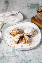 Freshly baked cream puffs. Eclair cake with cream and chocolate filling