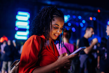 Girl texting at concert