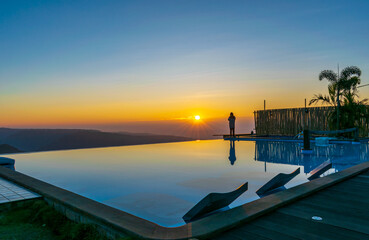 A view of sunrise against an infinity pool, Polo Orchid Resort, Cherrapunji, Meghalaya, India