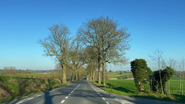 Real time dashcam footage of a car driving on the road in the afternoon in Brussels, Belgium