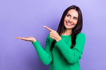 Photo of brunette hair young girl wear green pullover point finger hold arm look new whitening teeth clinic isolated on purple color background