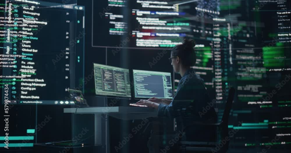 Poster Dolly Shot of Female Programmer Working in a Monitoring Control Room, Surrounded by Big Screens Displaying Lines of Programming Language Code. Portrait of Woman Creating a Software and Coding