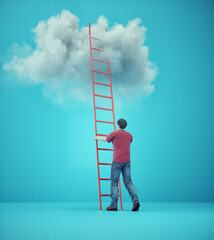 Man in front of a ladder to heaven. The concept of success.