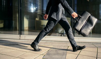 A businessman going to work with a briefcase