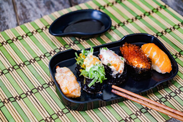 Sushi with salmon, prawn, avocado, cream cheese. Sushi menu. Japanese food.