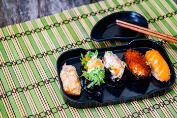 Sushi with salmon, prawn, avocado, cream cheese. Sushi menu. Japanese food.
