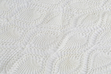 Lace tablecloth with repeating circular pattern. Crochet textile design. 