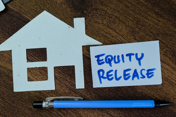 Concept of Equity Release write on sticky notes isolated on Wooden Table.