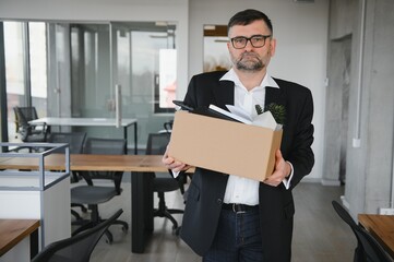 Old male employee in dismissal concept