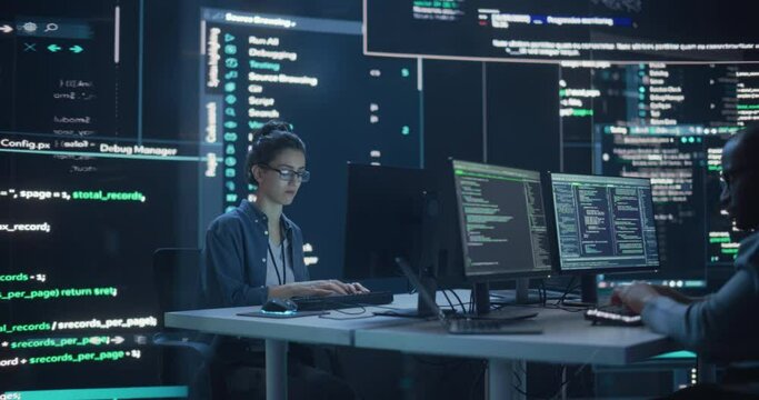 Portrait Two Diverse Developpers Working on Computers, Typing Lines of Code that Appear on Big Screens Surrounding Them. Male and Female Programmers Creating Innovative Software Together, Fixing Bugs