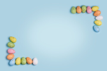Obraz premium Easter Pastel Blue Background with Decorated Eggs
