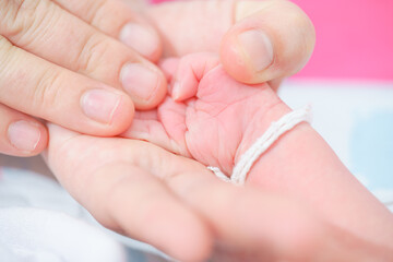 Portrait of a newborn Asian baby girl sleep on the bed , cute Fat baby 5 day.