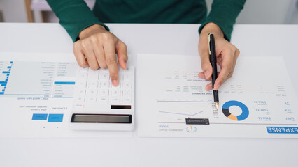 Young Asian household woman busy with bills and taxation, using calculator, make payment on tablet of family budget.