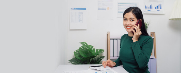 Young Asian household woman busy with bills and taxation, using calculator, make payment on tablet...