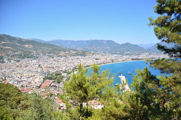 Fototapeta na wymiar A view to the waterfront and port in Alanya from the mountain