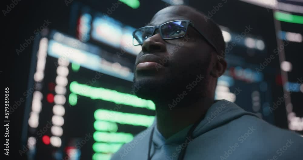 Poster Portrait of Young Black Man Looking at Big Digital Screens Glitching While Displaying Code Lines. Worried Professional Programmer Fixing a Bug, Dealing with Crashing System, Thinking of Solutions