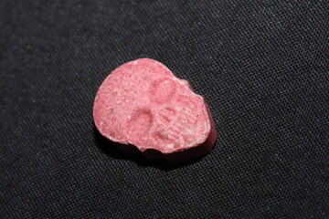 Pink skull ecstasy pill close up background high quality prints purple army dope narcotics...