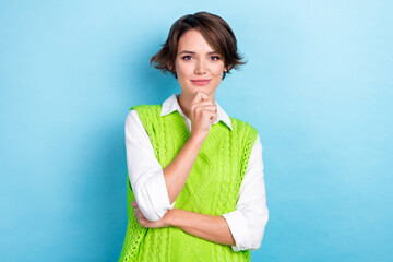 Photo of serious minded successful lady wear green stylish clothes arm face thinking question isolated on cyan color background