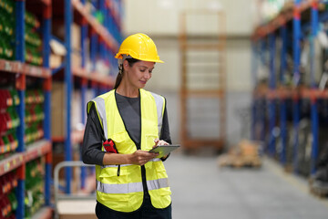 Worker Doing Inventory in Warehouse. Dispatcher in uniform making inventory in storehouse. supply chain concept