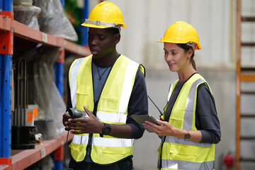  Warehouse workers checking the inventory. Products on inventory shelves storage. .Worker Doing...