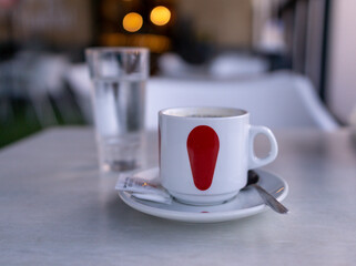having a coffee with milk for breakfast at the bar