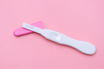 Unused pregnancy test isolated on the pink background. 