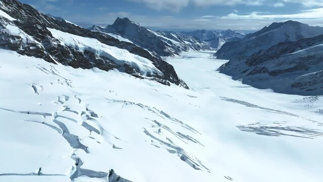 Aerial view of Great Aletsch Glacier, the largest glacier in the Alps and UNESCO heritage, in Canton of Valais, Switzerland. Aletsch glacier - ice panorama landscape in Alps of Switzerland, Europe