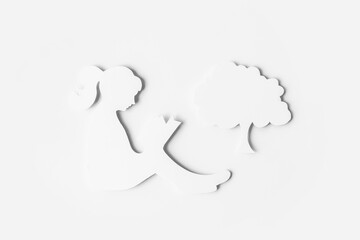 World Book and Copyright Day. silhouette of a girl reading a book and tree isolated on a white background
