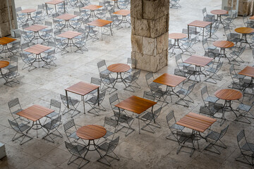 Large outdoor eating area with wooden tables and chairs