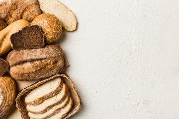 Homemade natural breads. Different kinds of fresh bread as background, top view with copy space