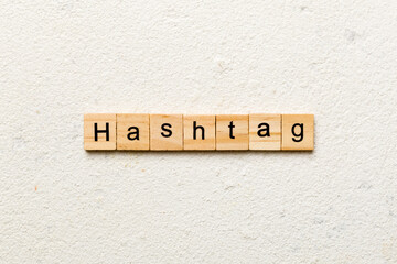 hashtag word written on wood block. hashtag text on table, concept