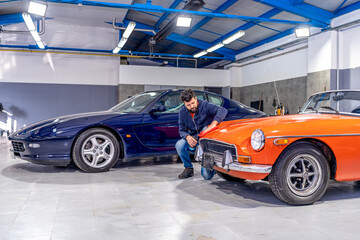 Fototapeta na wymiar service and maintenance of luxury cars in the garage