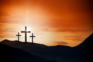 Easter cross on the dawn background