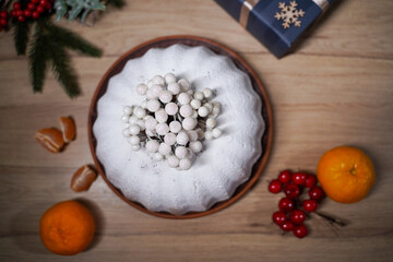Fruitcake for Christmas dinner. Cozy atmosphere, top view, selective focus