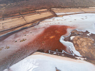Stunning aerial photos showcase the natural beauty and unique features of Pedra de Lume Saline in Sal Island, Cabo Verde. Witness the salt mines and picturesque village from above.