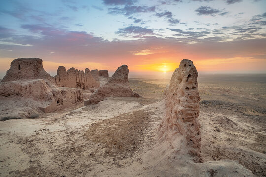 Ruins of ancient Khorezm fortress Ayaz Kala in Kyzylkum desert on sunrise, Uzbekistan