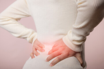 Young woman have waist pain, back ache, lumbar muscle injury problem. Office syndrome disease sick....