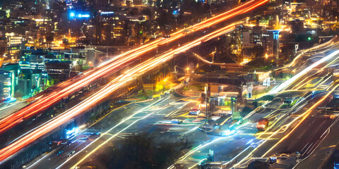 beautiful view of the city in the night, colorful street network around the city, street pattern with lights