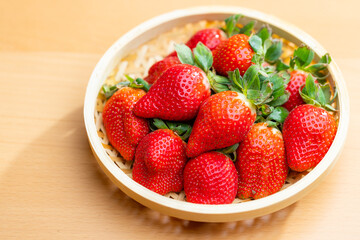 Fresh strawberries arranged on a basket
