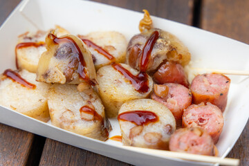 Grill sausage in paper box