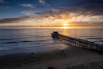 Fototapeta premium Drone shot of a metallic pier of the sea at sunset, cool for background