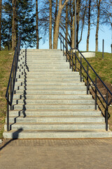 Concrete stairs with metal railings in the park